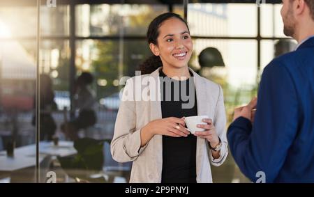 Coffee, happy and business people talking in office building, relax and happy while chatting. Team, woman and man enjoying conversation, break and Stock Photo