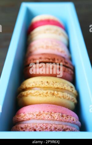 Assortment of beautiful colored Macaron pastries in light blue box Stock Photo