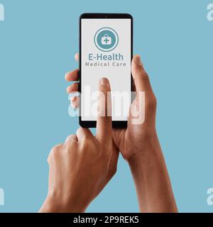 Hands, phone and mockup screen for healthcare, Telehealth or medical care against a blue studio background. Hand touching smartphone display for Stock Photo