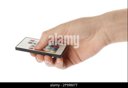 Woman holding remote control on white background, closeup Stock Photo