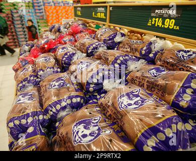 The price of a 10 pound bag of potatoes at 14.99 is seen at a