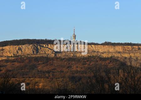 Large TV transmitter with satellite dishes and other antennas. Internet - wifi - mobile gsm signal. Concept for technology and industry. Brno - Hady. Stock Photo