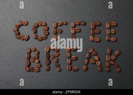 Phrase Coffee Break made of beans on black background, flat lay Stock Photo