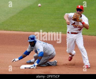 St. Louis Cardinals batter Cesar Cedeno, right, breaks his bat, but knocks  out a double in the fourth inning of their World Series game with the  Royals at Kansas City, Oct. 19