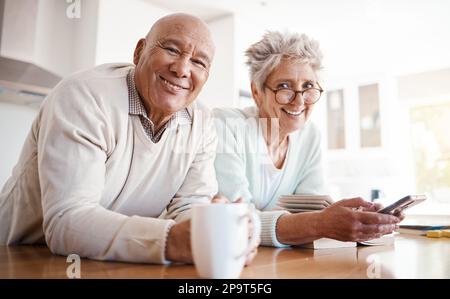 Portrait, senior and old interracial couple relax in home kitchen in the morning with coffee happy, smile and confident together. Old man and elderly Stock Photo