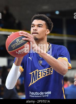 Levallois Perret, France. 10th Mar, 2023. Metropolitan 92' power forward  Victor Wembanyama (R) fights for the ball with Nancy's Caleb Walker (2ndL)  during the French Elite basketball match between Boulogne-Levallois  Metropolitans 92