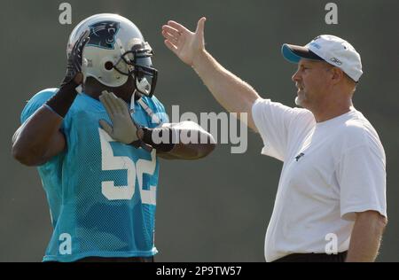 Carolina Panthers linebackers coach Ken Flajole gives instructions to  rookie Jon Beason during Beason's first practice at training camp in  Spartanburg, South Carolina, Monday, August 6, 2007. (Photo by David T.  Foster