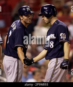 HOT START: Milwaukee's J.J. Hardy is congratulated by teammate Corey Hart  after scoring the game winning