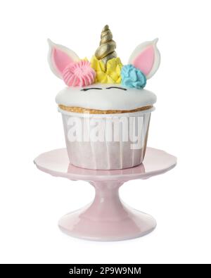 Dessert stand with cute sweet unicorn cupcake isolated on white Stock Photo