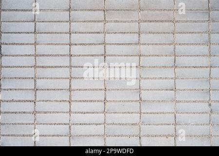 Background from a wall made of rectangular beige mosaic tiles Stock Photo