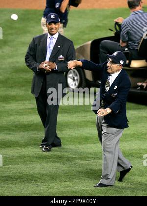 Former New York Yankees player Reggie Jackson pretends to swing before  throwing out the first pitch in game 2 of the ALDS against the Minnesota  Twins at Yankee Stadium in New York