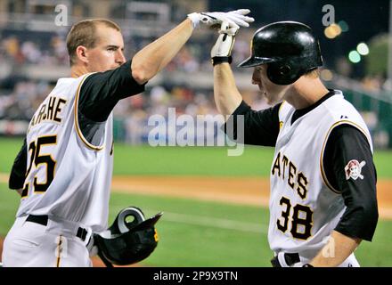 Pittsburgh Pirates' Jason Bay trots around third to greetings from