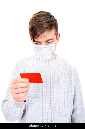 Young Man in Flu Mask hold a Bank Card Isolated on the White Background Stock Photo