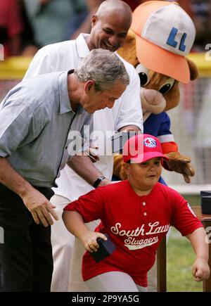 Former Major League Baseball pitcher Jose Rijo, an All-Star and World  Series Most Valuable Player, coaches first base during a Tee Ball game on  the South Lawn of the White House in