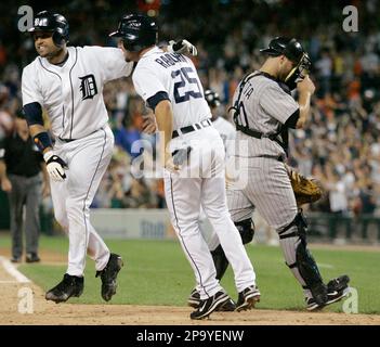 Detroit Tigers' Placido Polanco, right, is congratulated by Miguel Cabrera  after scoring in the third inning of a baseball game against the Kansas  City Royals, Saturday, Aug. 30, 2008, in Detroit. (AP