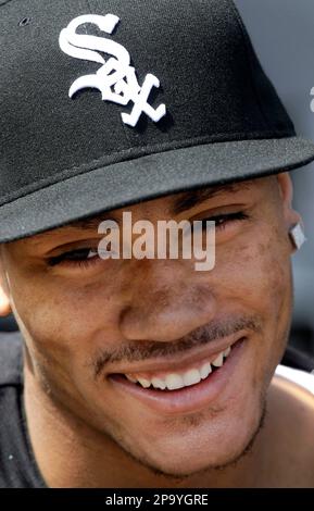 Bulls draft pick Derrick Rose dons a White Sox hat as he stands beside  Chicago White Sox manager Ozzie Guillen during pre-game activities at U.S.  Cellular Field in Chicago, Illinois, Friday, June