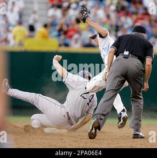 North Carolina second baseman Kyle Seager receives the ball from shortstop  Ryan Graepel (not shown) before turning a double play against LSU to end  the second inning of an NCAA College World