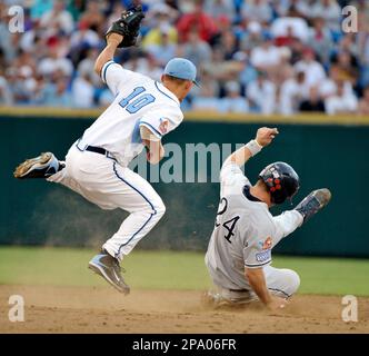 North Carolina second baseman Kyle Seager receives the ball from shortstop  Ryan Graepel (not shown) before turning a double play against LSU to end  the second inning of an NCAA College World