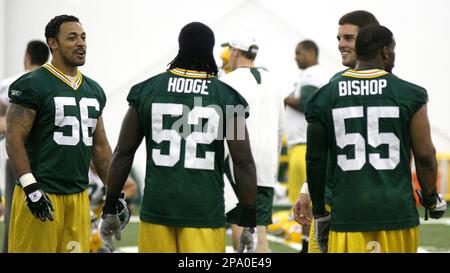 Seattle Seahawks running back Shaun Alexander (37) leaves Green Bay  Packers' Abdul Hodge lying in the snow as Packers' Aaron Kampman, left, and  A.J. Hawk, right, zero in for a tackle Monday, Nov. 27, 2006 in an NFL  football game at Qwest Field in