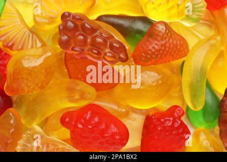 Tasty jelly candies in shape of different fruits, closeup Stock Photo