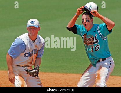 North Carolina's Kyle Seager, left, and Mike McKee (38) celebrate their 9-3  win over East Carolina during a NCAA super regional college baseball  championship game in Chapel Hill, N.C., Sunday, June 7