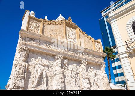 The greek fountain is located in Gallipoli, near the bridge that connects the new town to the old town. This fountain is the oldest in Italy, and is Stock Photo