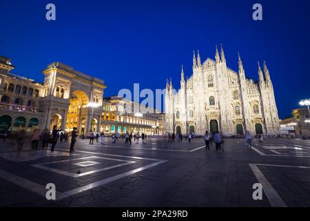 MILAN, ITALY - APRIL 28th, 2018: turists during blue hour taking pictures in Duomo Square, the main landmark of the city Stock Photo