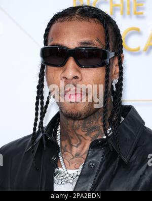 Bel Air, USA. 11th Mar, 2023. BEL AIR, LOS ANGELES, CALIFORNIA, USA - MARCH 10: American rapper Tyga (Micheal Ray Stevenson) arrives at the Darren Dzienciol and Richie Akiva Oscar Party 2023 held at a Private Residence on March 10, 2023 in Bel Air, Los Angeles, California, USA. (Photo by Xavier Collin/Image Press Agency) Credit: Image Press Agency/Alamy Live News Stock Photo