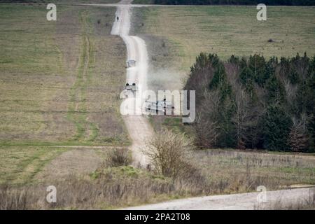 Two British army military AS90 (AS-90 Braveheart Gun Equipment 155mm L131) armoured self-propelled howitzer on a military exercise, Wiltshire UK Stock Photo