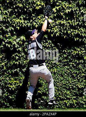 Colorado Rockies center fielder Cory Sullivan can't make the catch on a triple hit by Chicago Cubs' Jim Edmonds during the second inning of a baseball game Sunday, June 1, 2008 in Chicago. (AP Photo/Nam Y. Huh)