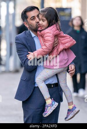SNP leadership candidate Humza Yousaf arrives with his daughter Amal for the SNP leadership hustings, at the University of Strathclyde in Glasgow. Picture date: Saturday March 11, 2023. Stock Photo
