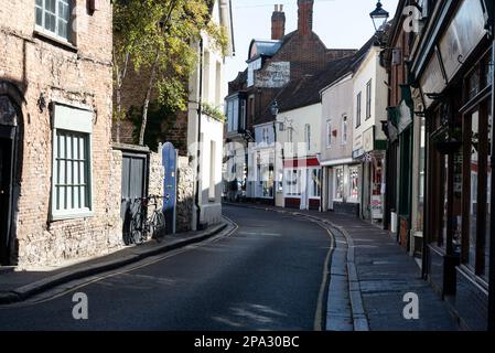 A narrow shopping street- King Street in Sandwich Kent, Britain.  Sandwich is one of England’s most historic towns where the street plan has changed l Stock Photo