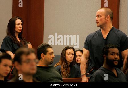 Professional bodybuilder Kelly Ryan, right, reads a statement to the ...