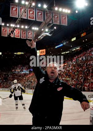 Al Sobotka, Joe Louis Arena building operations manager, swings an