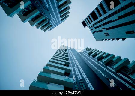 Directly Below Skyscraper Against Sky in Dusk in Milan, Lombardy, Italy. Stock Photo