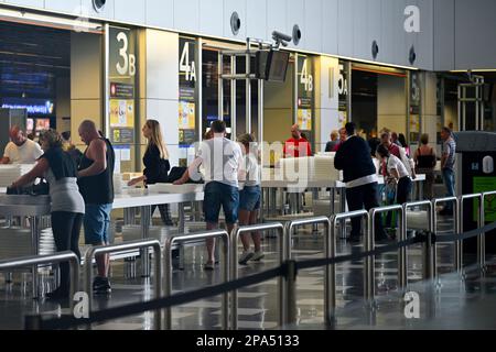 Airport passengers going through security for flights in check in area, Gran Canaria Airport Stock Photo