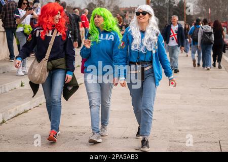 Rome, Italy. 11 March 2023. Italy  rugby fans wearing wigs in the colours of the Italian flag arrive at  Rome olympic stadium for the  Italy v Wales Guinness  6 nations rugby match Credit: amer ghazzal/Alamy Live News Stock Photo