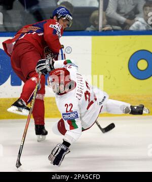 Czech Republic forward Patrik Elias, right, trips over Switzerland forward  Thierry Paterlini during first period action at the IIHF world hockey  championships, Thursday May 8, 2008, in Quebec City. (AP Photo/The Canadian