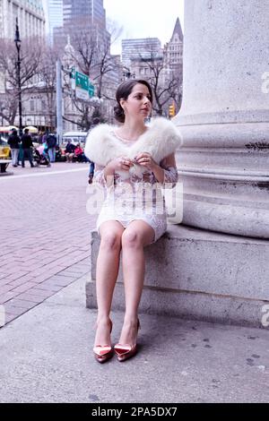 New York, NY USA - 03 29 2013: Bride Sitting on a Column Pedestal Stock Photo