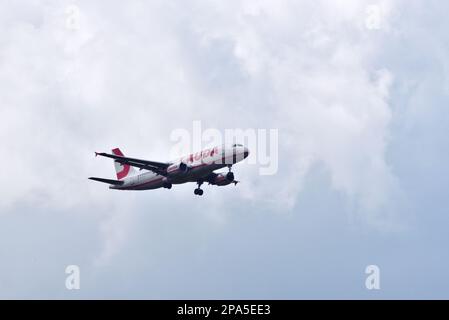 Lauda Europe Maltese registered Airbus A320-214 9H-LOI on final approach to Bournemouth International Airport on a flight from Majorca on 7/5/22. Stock Photo