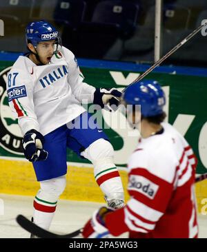 Czech Republic forward Patrik Elias, right, trips over Switzerland forward  Thierry Paterlini during first period action at the IIHF world hockey  championships, Thursday May 8, 2008, in Quebec City. (AP Photo/The Canadian