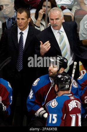 Colorado Avalanche head coach Joel Quenneville (R) wears his old Colorado Rockies  hockey jersey during press conference unveiling the NHL's and Colorado  Avalanche's newly designed Reebok Rbk EDGE uniforms at the Pepsi