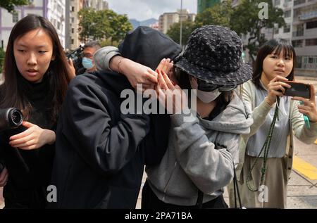 Irene Pun Hau-yin ( In black hoodie), the seventh suspect who is charged over allegedly trying to help Choi's ex-husband Alex Kwong Kong-chi in the brutal murder of model Abby Choi Tin-fung, leaves Kowloon City Court after she was granted bail. 08MAR23    SCMP / Elson Li Stock Photo