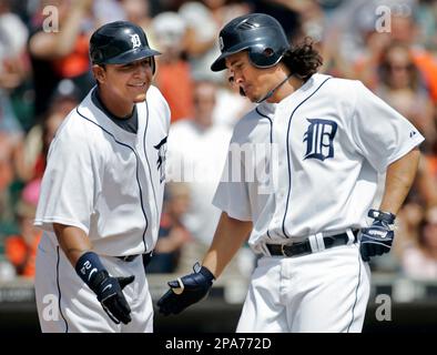 Detroit Tigers' Placido Polanco, right, is congratulated by Miguel Cabrera  after scoring in the third inning of a baseball game against the Kansas  City Royals, Saturday, Aug. 30, 2008, in Detroit. (AP