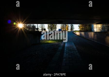 Low autumn sun shines in pedestrian underpass, Urban architecture photo, Shadow and light, No people, Vasteras, Sweden Stock Photo