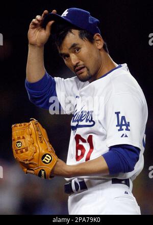 Los Angeles Dodgers pitcher Chan Ho Park delivers a high kick to
