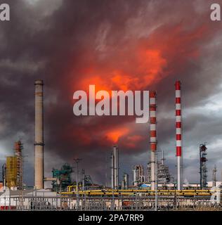 Large oil refinery complex, with chimneys and towers Stock Photo