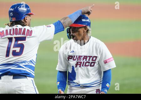 Puerto Rico infielder Francisco Lindor, right, yells after he tagged out  Nicaragua's Juan Diego Montes (99) as Montes tried to steal the second base  during the fourth inning of a World Baseball