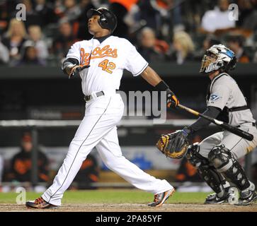 Baltimore Orioles' Adam Jones wears striped socks as he walks on