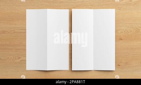 Half-folded flyer A4 vertical booklet mock up on wooden background. View directly above Stock Photo